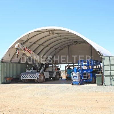 A crane and truck underneath a DomeShelter.