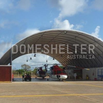 Two Helicopters parked under the DomeShelter™ Container Mounted model.