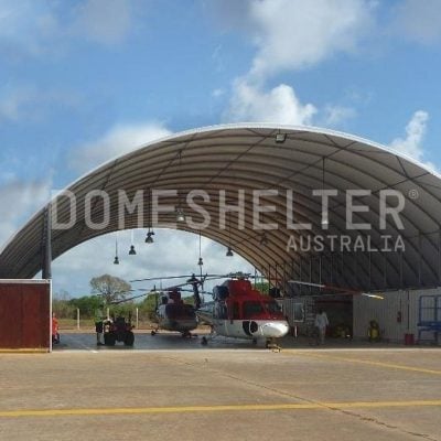 Two Helicopters parked under the DomeShelter™ Container Mounted model in Tanzania.