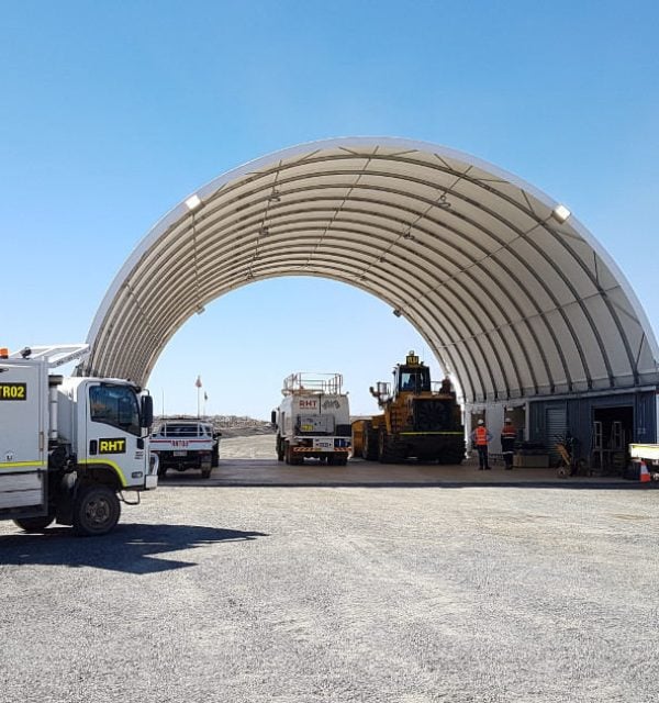 Heavy machinery and vehicles stored under DomeShelter.