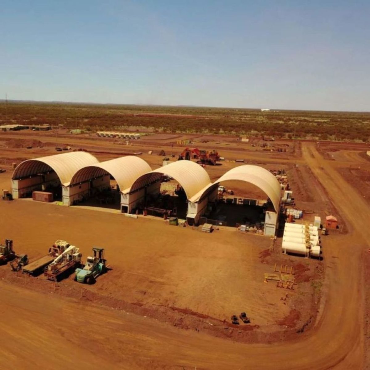 Row of dome fabric shelters on a mine site in the Pilbara