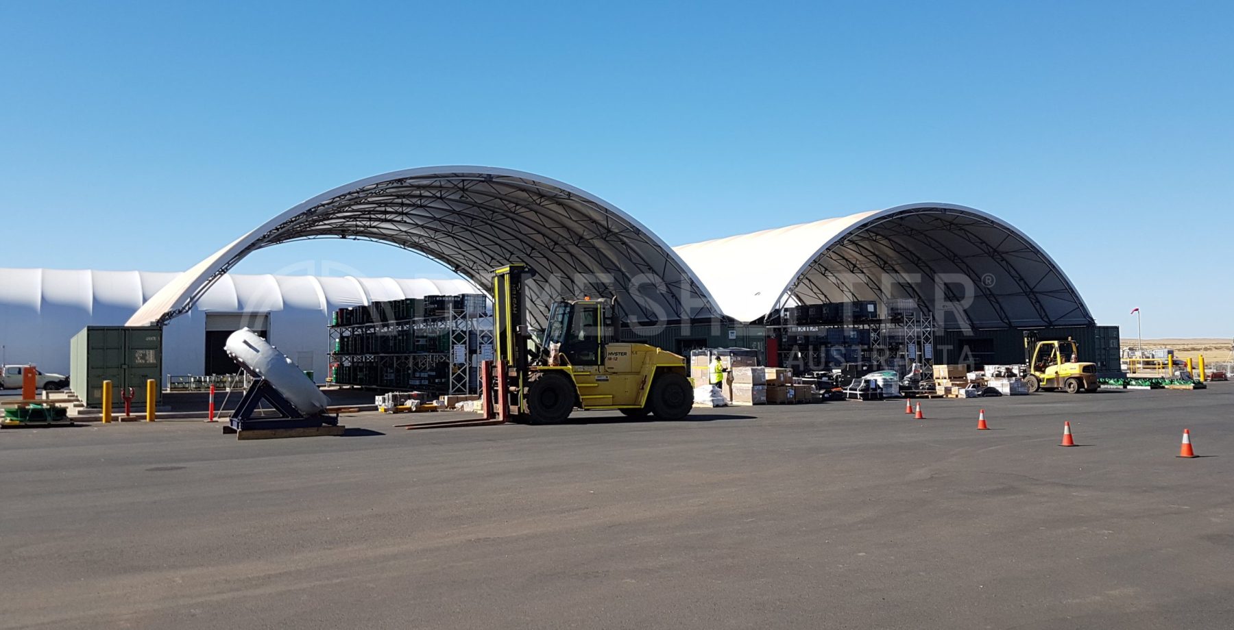 large Shipping Container Shelters in an industrial setting