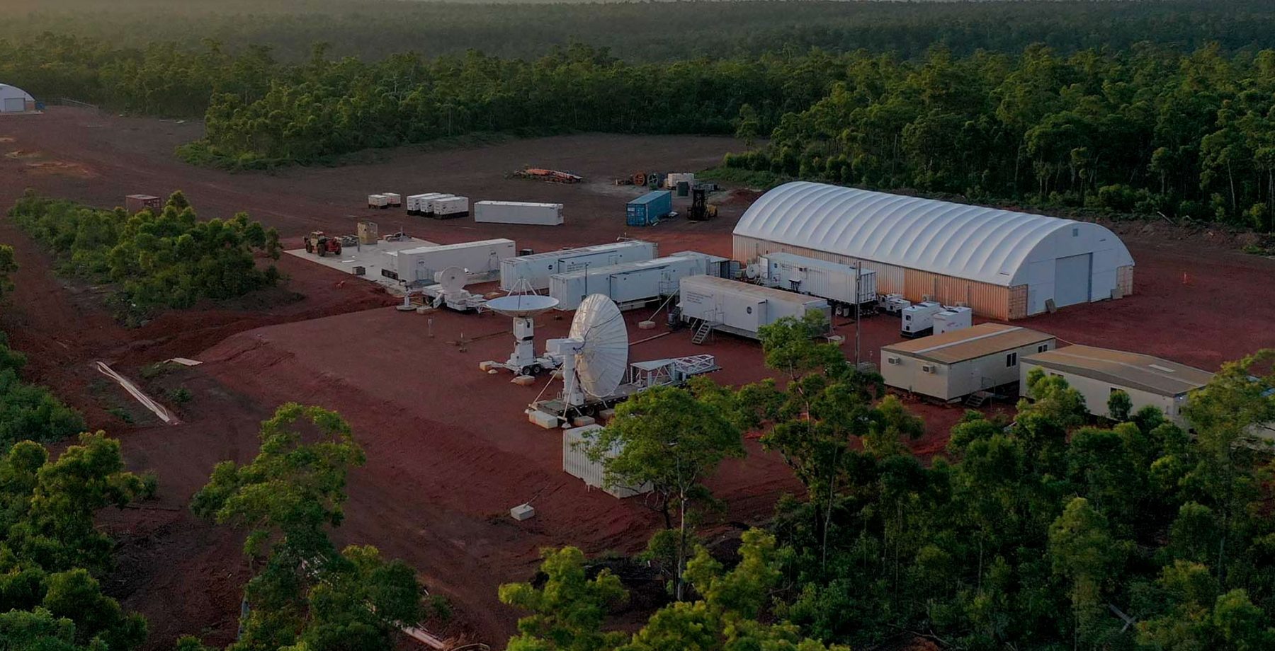 Drone captured photo over a remote site with Container Dome Fabric Structures