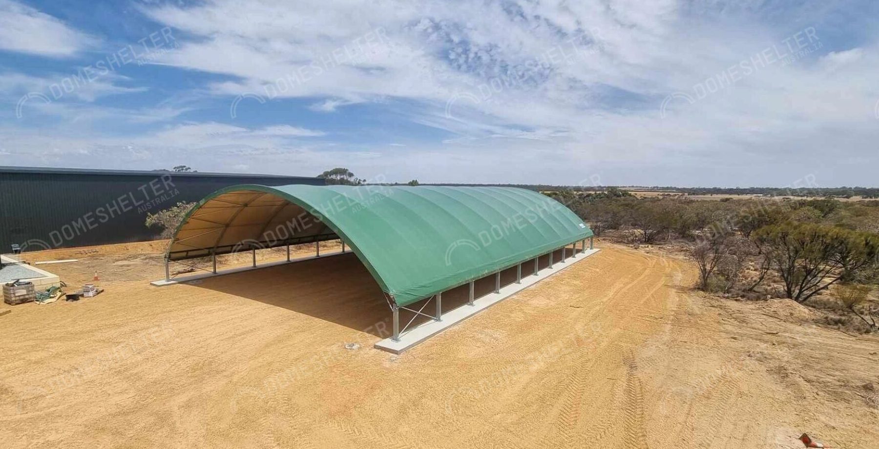 Large, green container dome structure for Machinery Storage