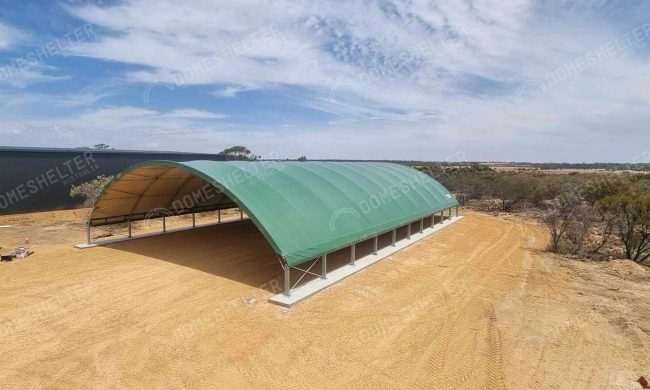 Large, green container dome structure for Machinery Storage